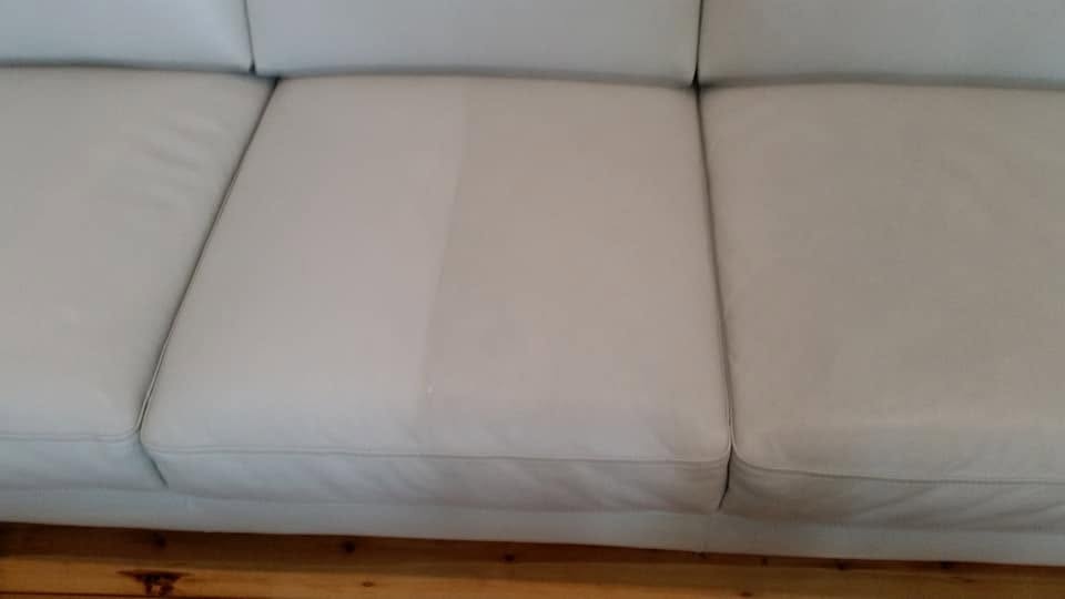 Upholstery cleaning technician working on a fabric sofa in Adelaide
